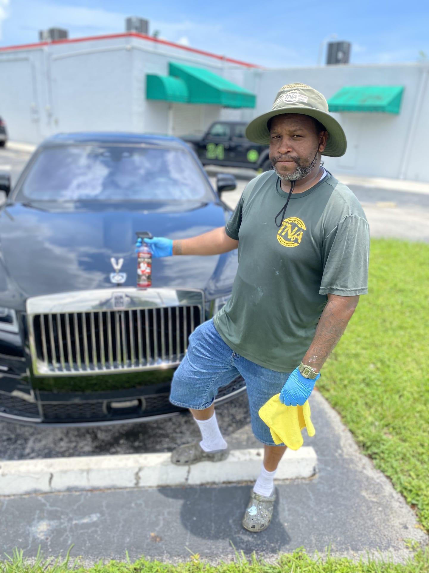 TNA team member detailing a Rolls-Royce on site