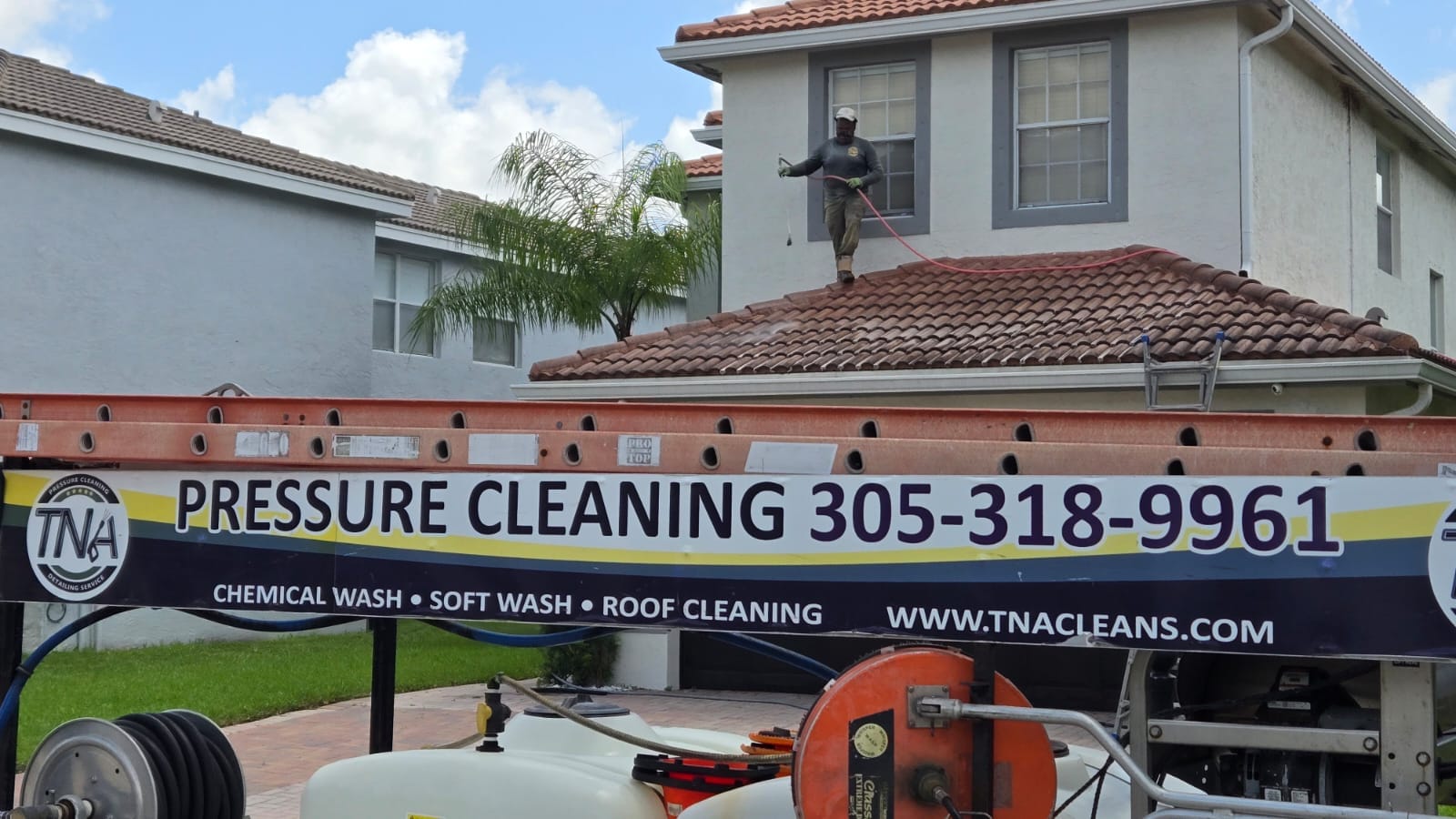 Soft washing a barrel-tile roof from a TNA pressure cleaning rig