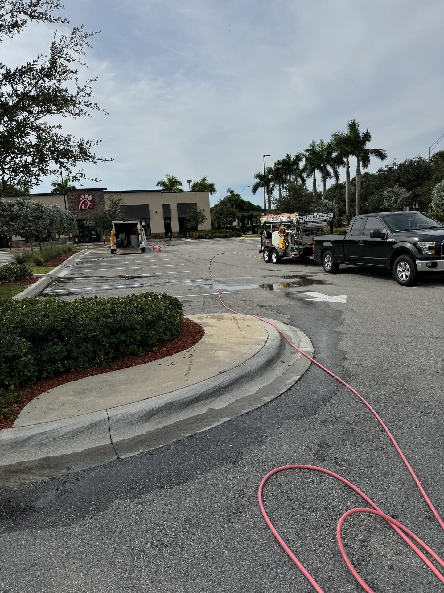 Pressure cleaning a commercial drive-thru and walkways