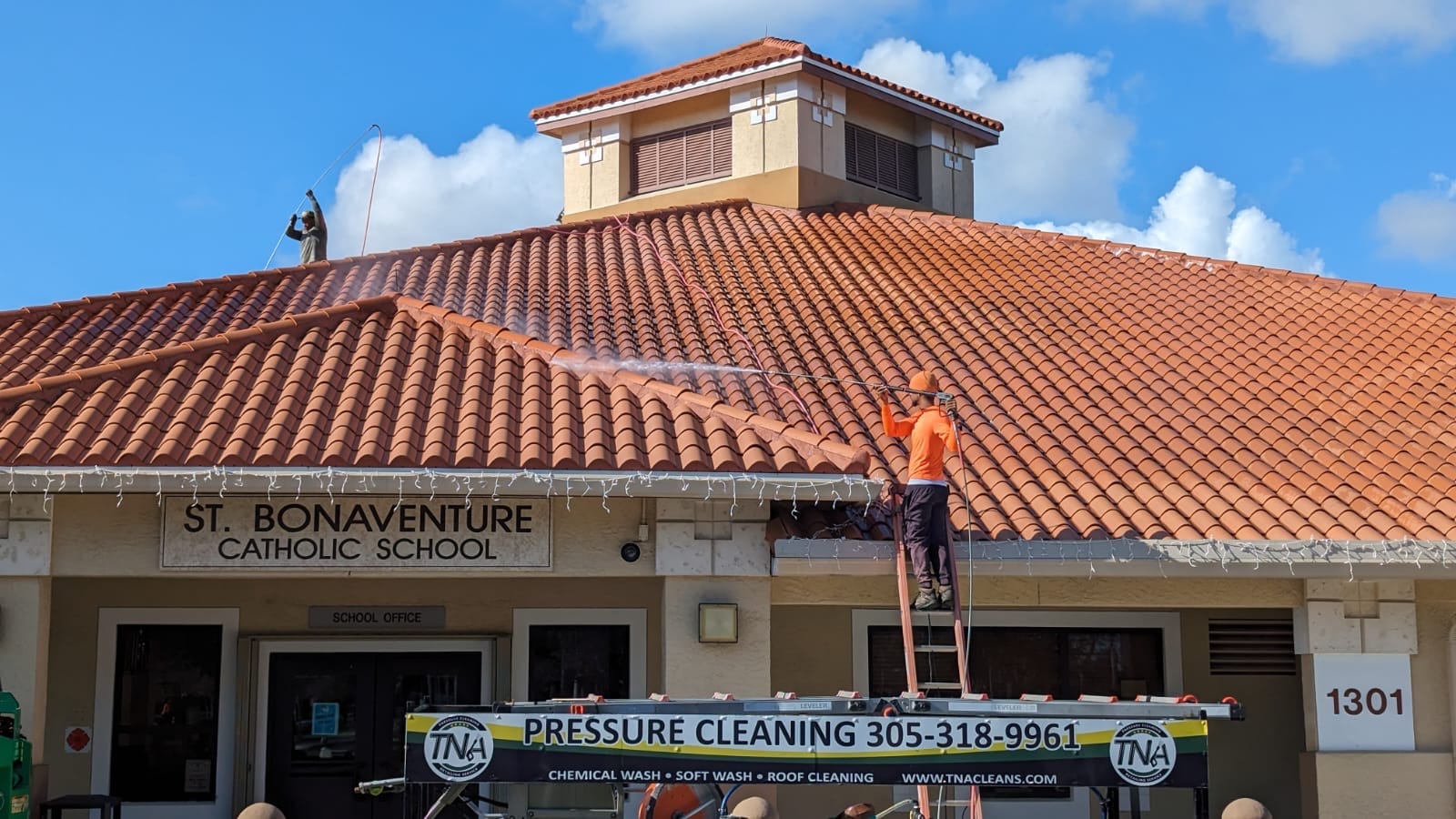 Soft washing the tile roof at St. Bonaventure Catholic School