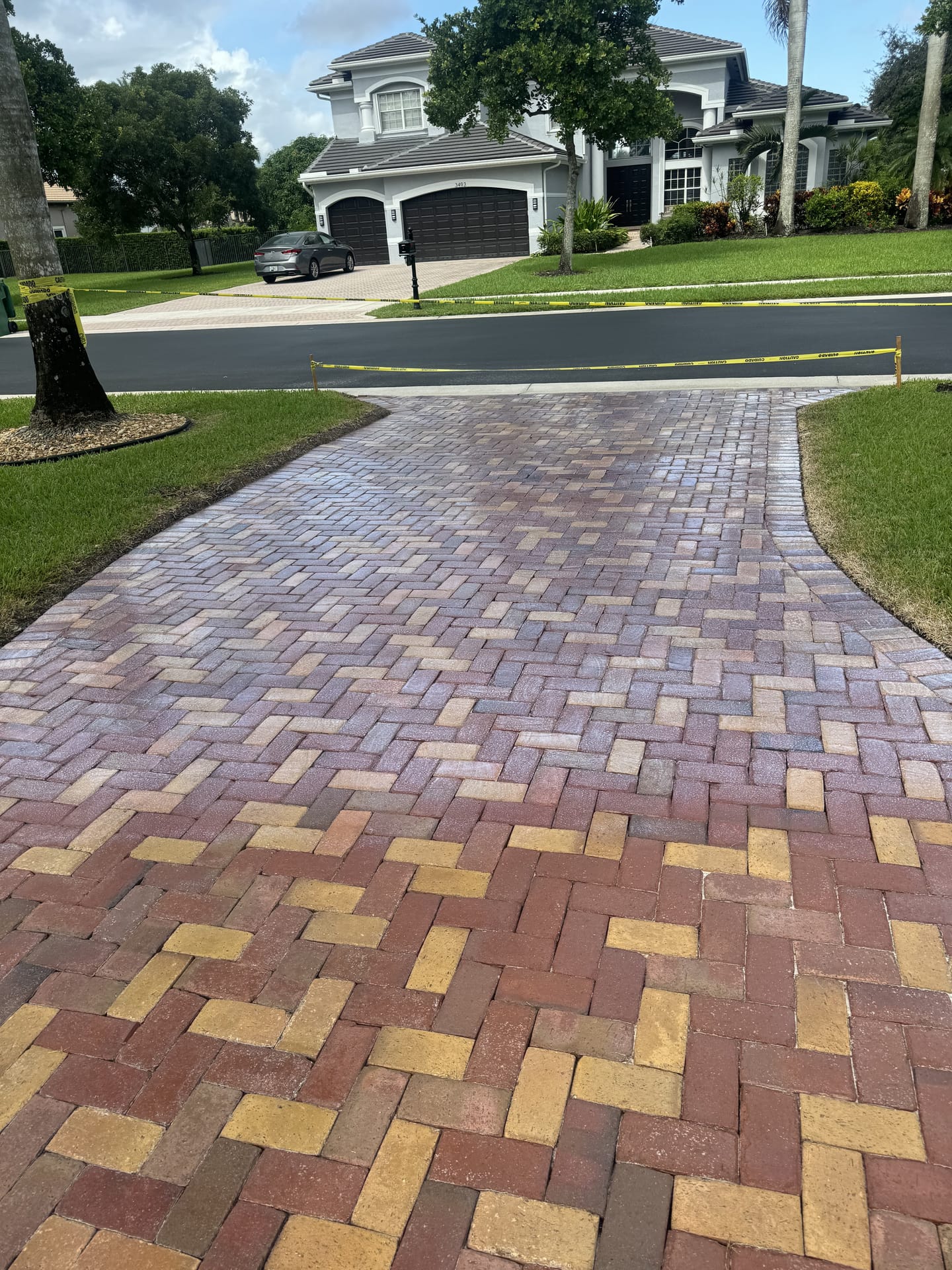 Restored paver driveway with rich color after cleaning