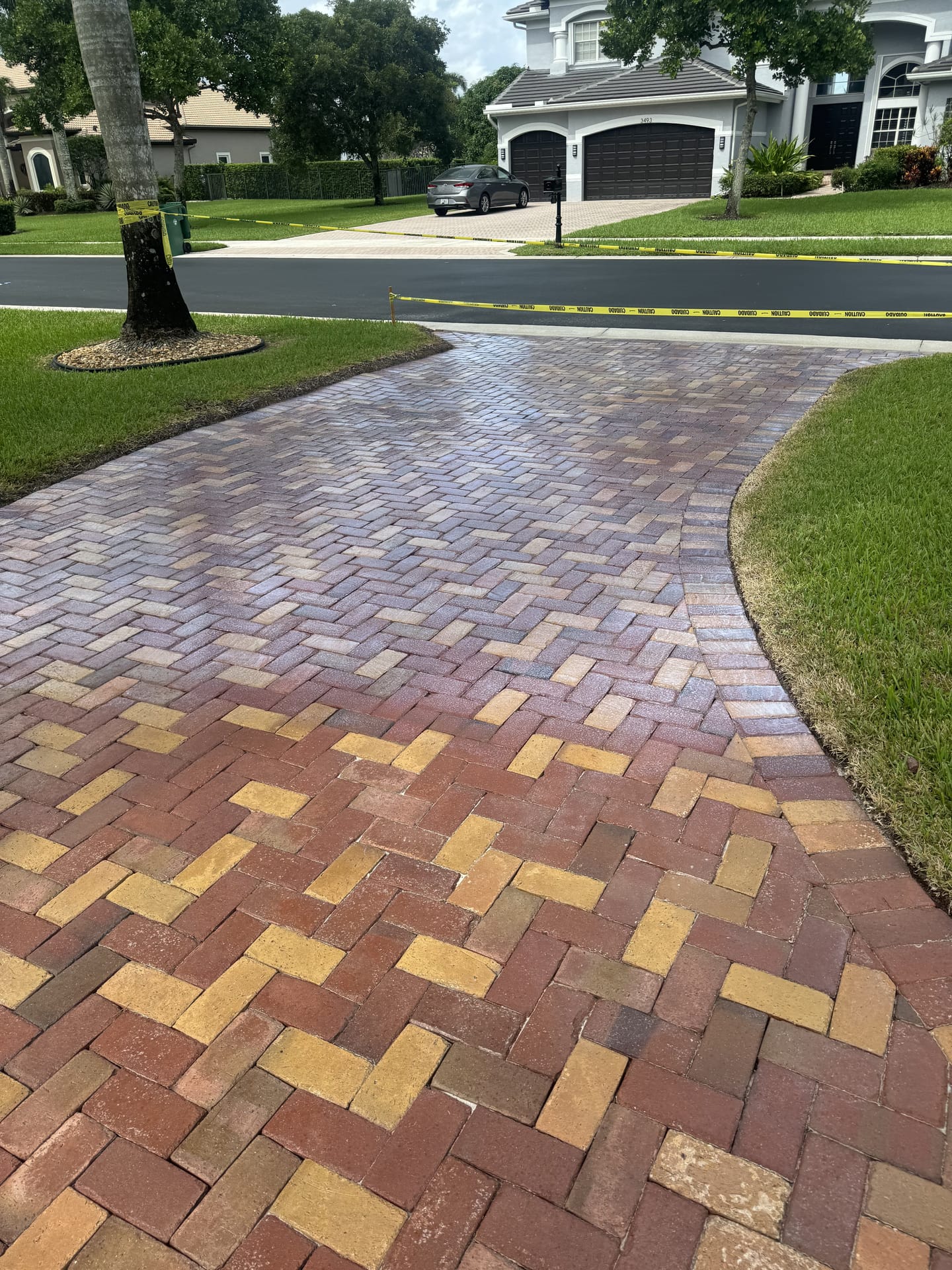 Brick paver driveway cleaned and sealed by TNA